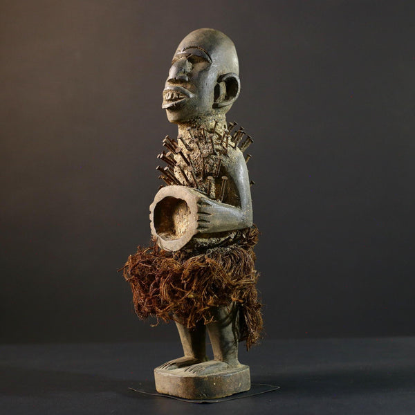 African Nkisi Nkondi nailed fetish statue Congo power figure tribal charm carved wood ritual art protective totem cavity raffia skirt-G5371