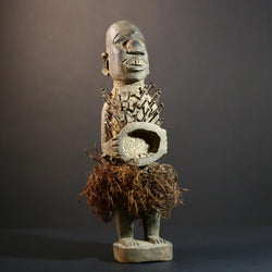 African Nkisi Nkondi nailed fetish statue Congo power figure tribal charm carved wood ritual art protective totem cavity raffia skirt-G5371