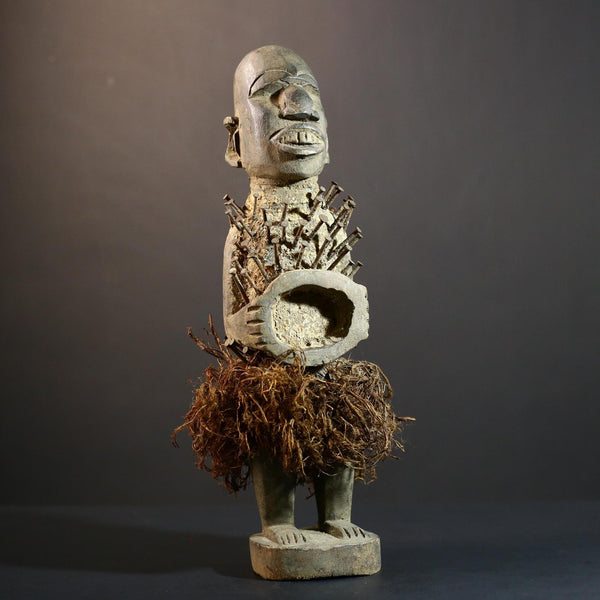 African Nkisi Nkondi nailed fetish statue Congo power figure tribal charm carved wood ritual art protective totem cavity raffia skirt-G5371