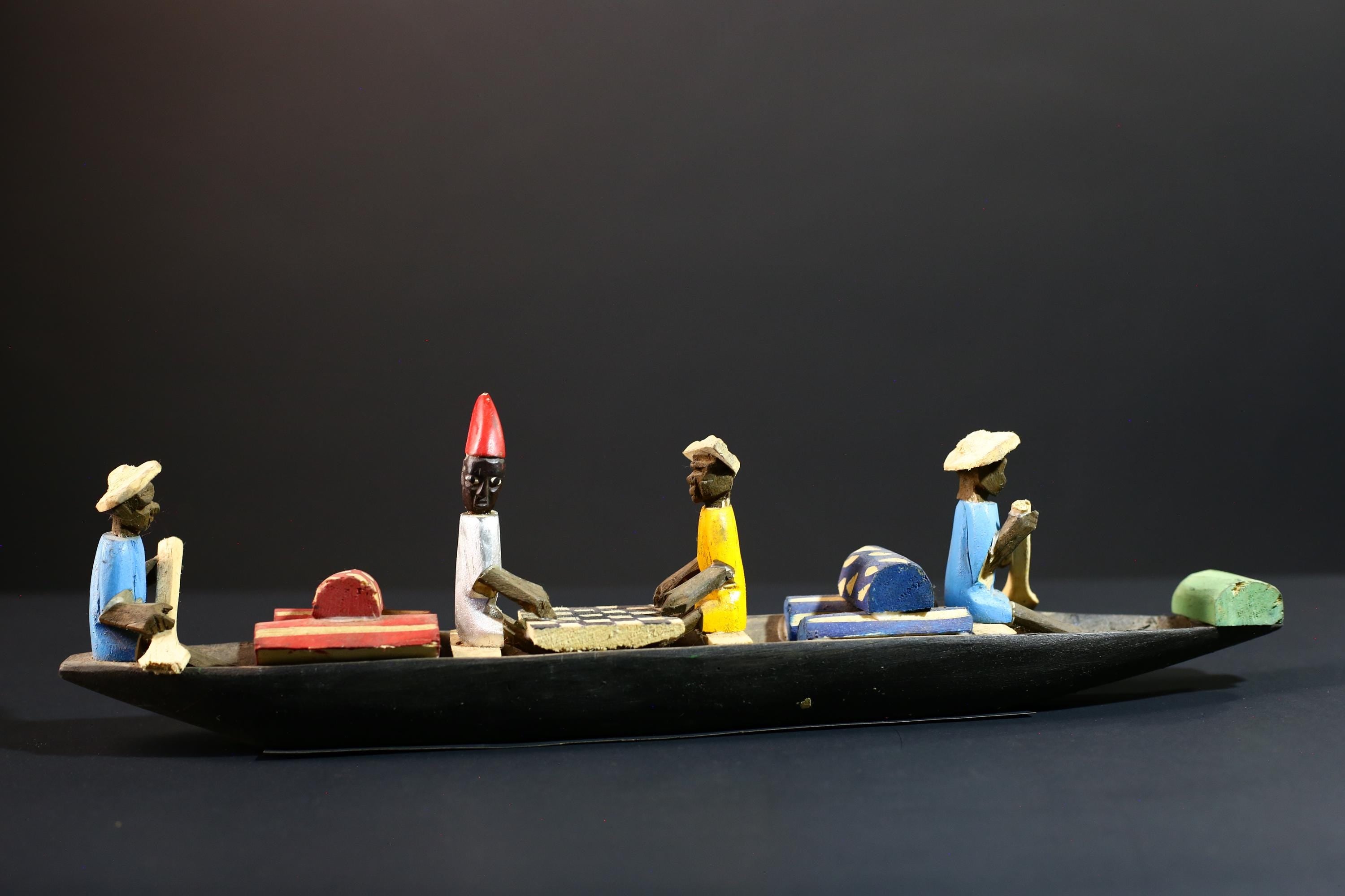 African canoe sculpture, river trade folk art decor, hand carved wooden boat, Congolese village scene, colorful African figures-G5405