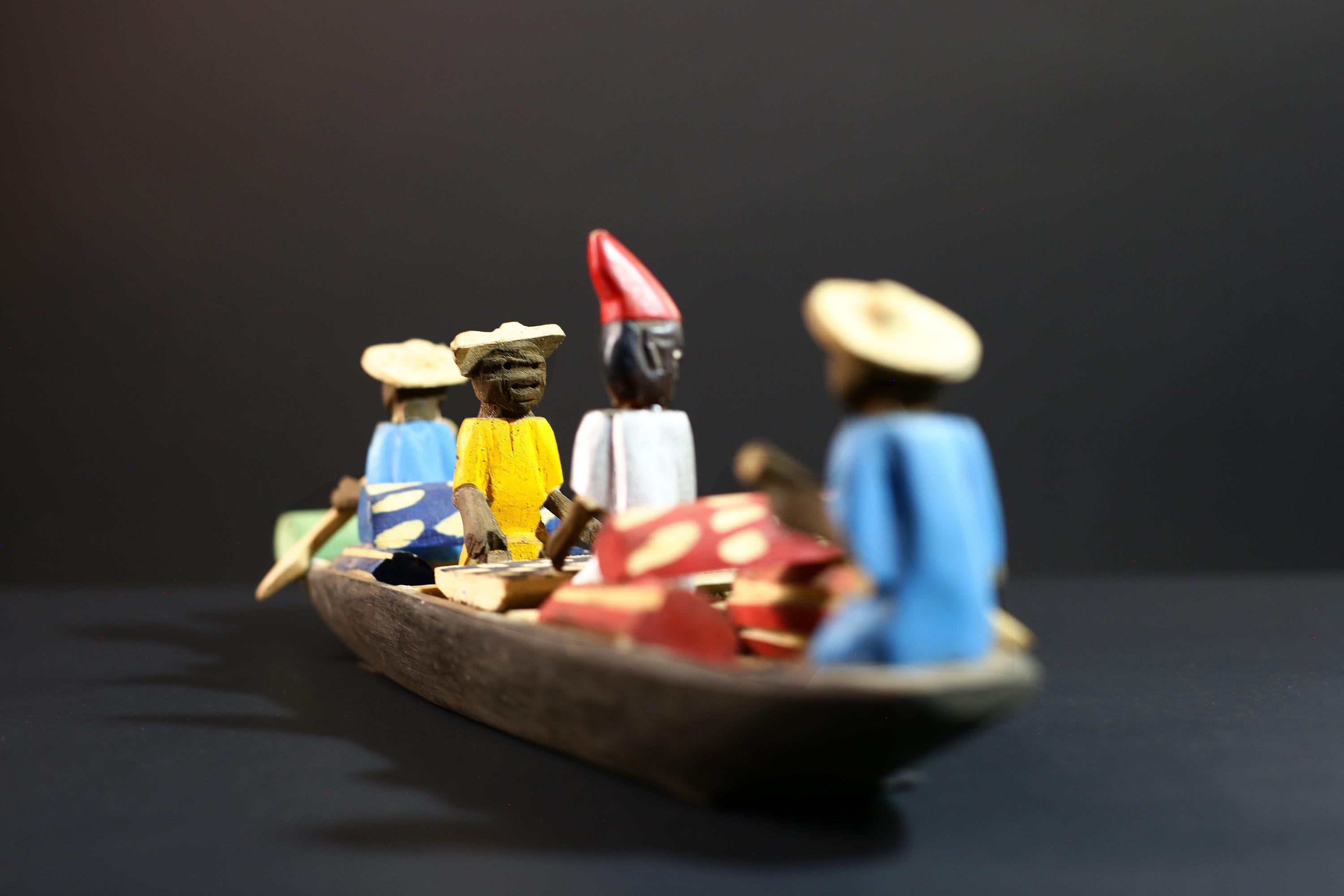 African canoe sculpture, river trade folk art decor, hand carved wooden boat, Congolese village scene, colorful African figures-G5405