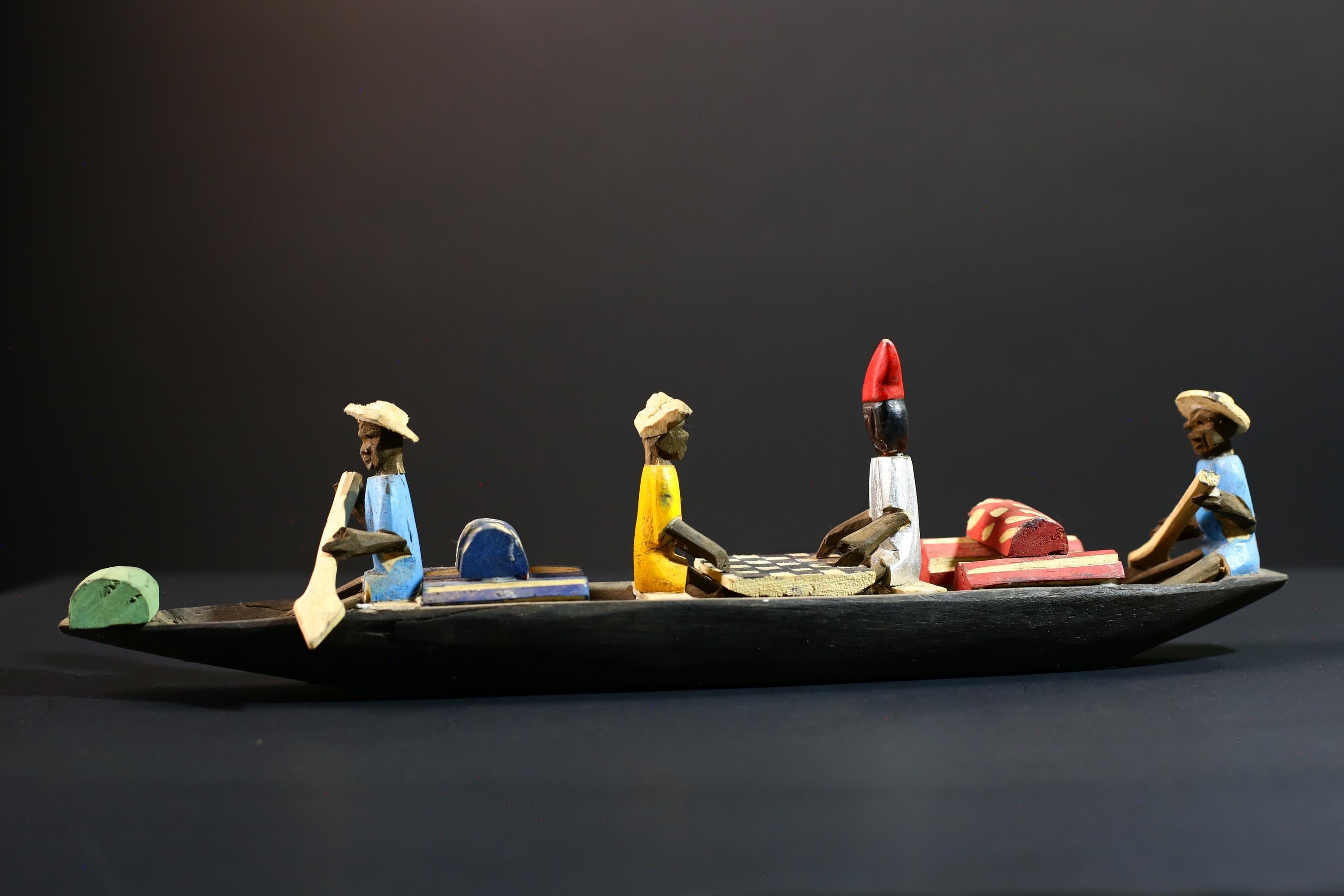 African canoe sculpture, river trade folk art decor, hand carved wooden boat, Congolese village scene, colorful African figures-G5405