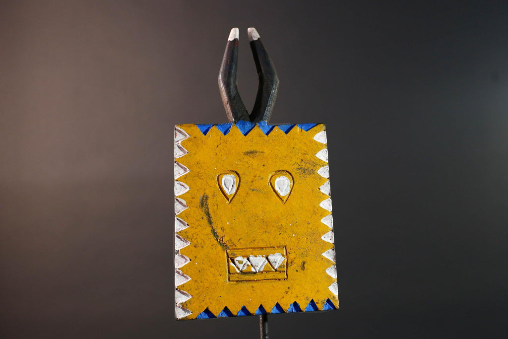 African wall decor Bwa tribal sun mask yellow geometric face with blue white painted motifs and pronged crest cultural home display G5496