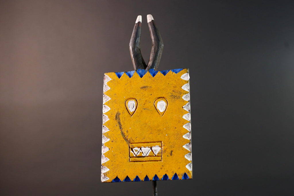 African wall decor Bwa tribal sun mask yellow geometric face with blue white painted motifs and pronged crest cultural home display G5496
