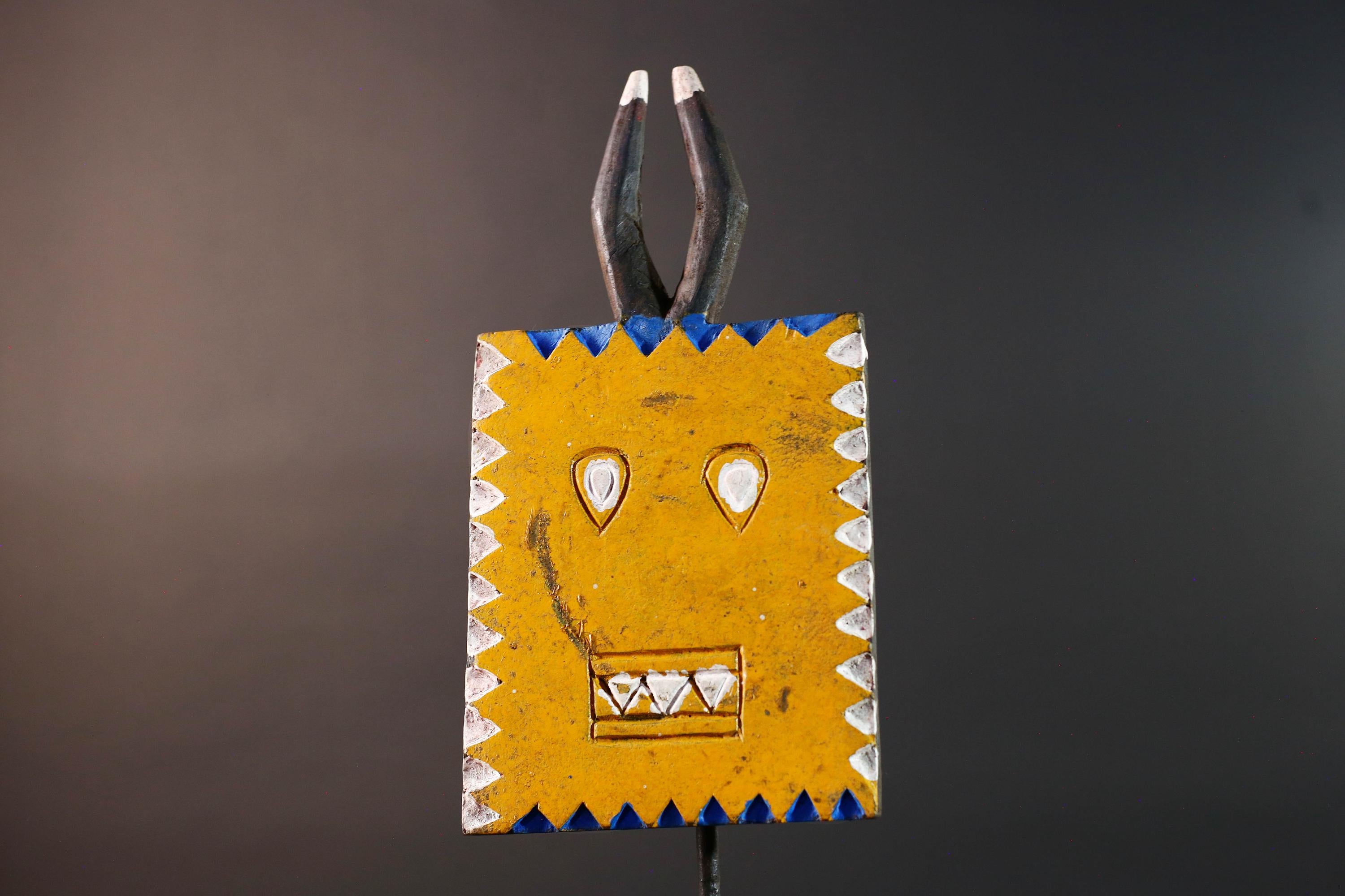 African wall decor Bwa tribal sun mask yellow geometric face with blue white painted motifs and pronged crest cultural home display G5496