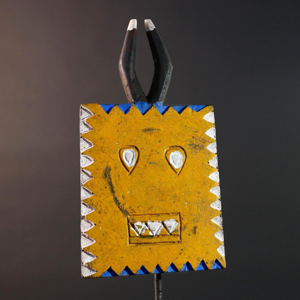 African wall decor Bwa tribal sun mask yellow geometric face with blue white painted motifs and pronged crest cultural home display G5496