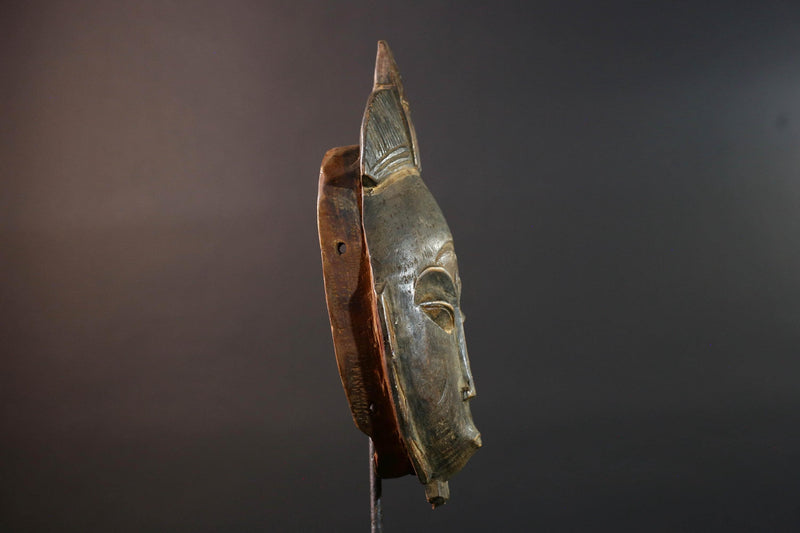 African wall decor Baule tribal mask with downcast eyes geometric accents and tall domed crest for symbolic interior statement piece G5498