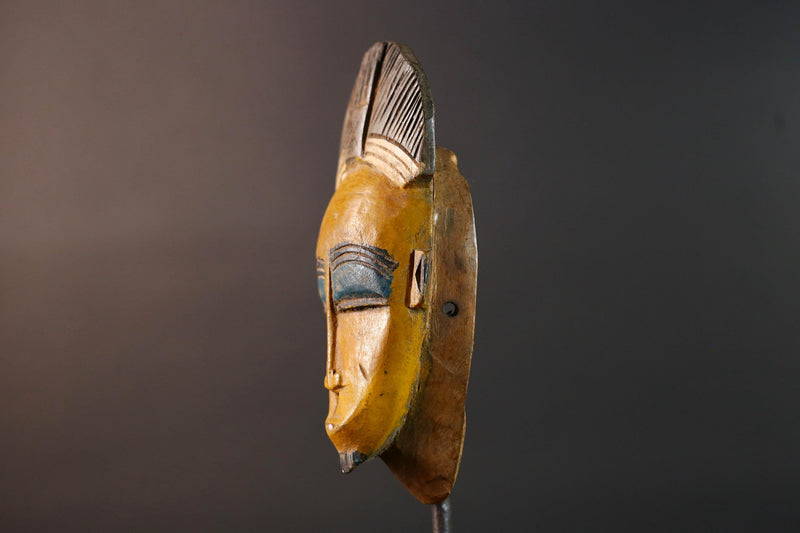 Baule tribal wall decor mask with yellow face blue brow ridged crest and scarified cheeks for african spiritual home interior design G5500