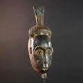 Africa tribal wall mask Baule carving with tall ridged crest narrow face and symbolic cheek marks for spiritual interior statement art G5502
