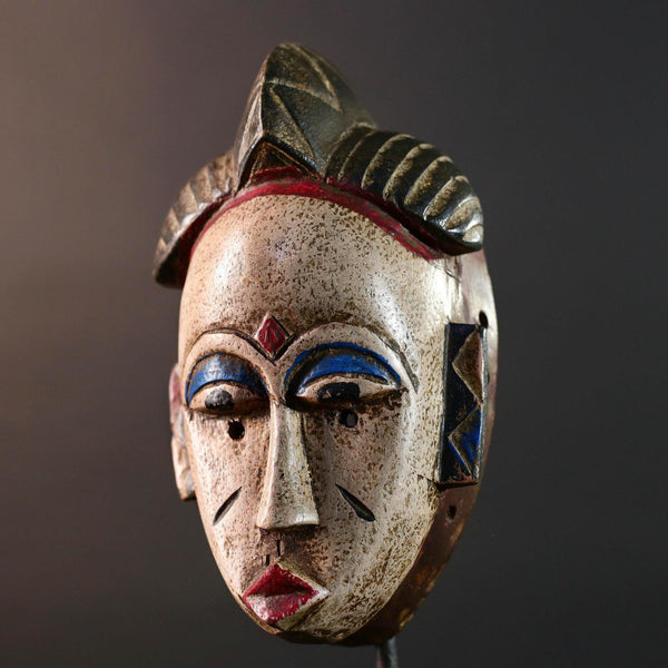 African tribal mask Baule carved wood wall decor with scarification red lips blue brows ivory tone artisan spiritual face sculpture-G5520