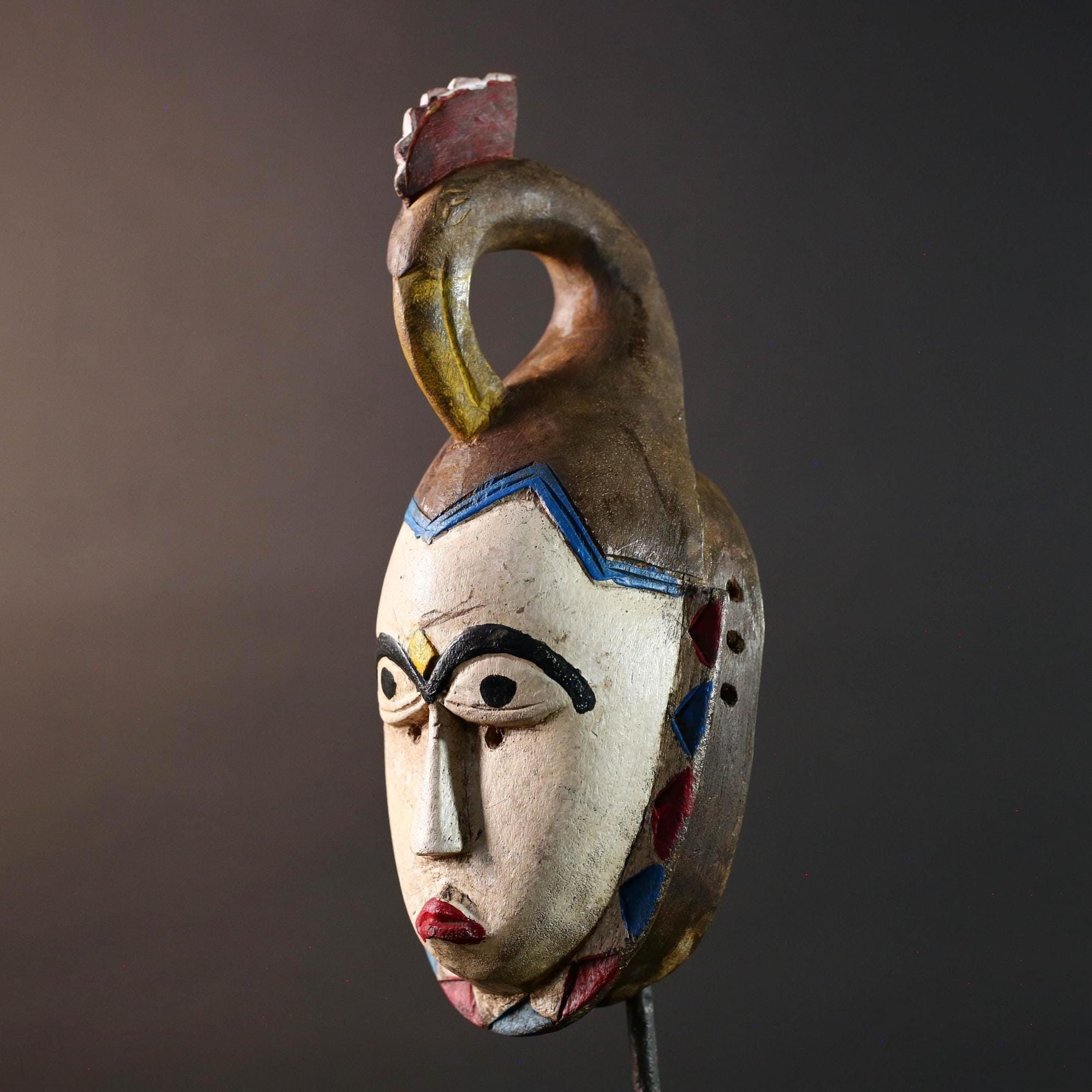 African tribal mask Guro carved wood wall decor with pale face red lips arched brow animal crest artisan symbolic ethnic sculpture-G5519