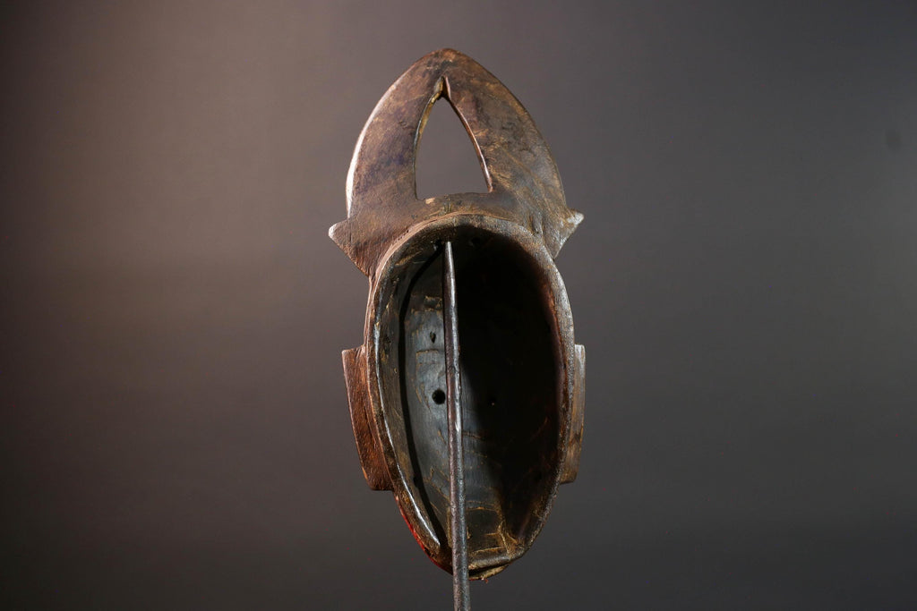 African tribal mask Guro carved wood wall decor with red face double horn crest stylized eyes artisan figure symbolic ethnic art-G5518