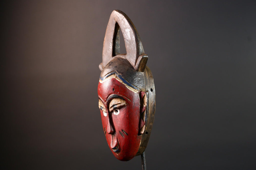 African tribal mask Guro carved wood wall decor with red face double horn crest stylized eyes artisan figure symbolic ethnic art-G5518