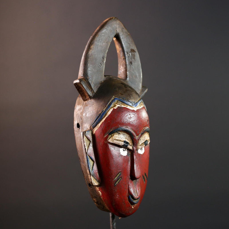 African tribal mask Guro carved wood wall decor with red face double horn crest stylized eyes artisan figure symbolic ethnic art-G5518