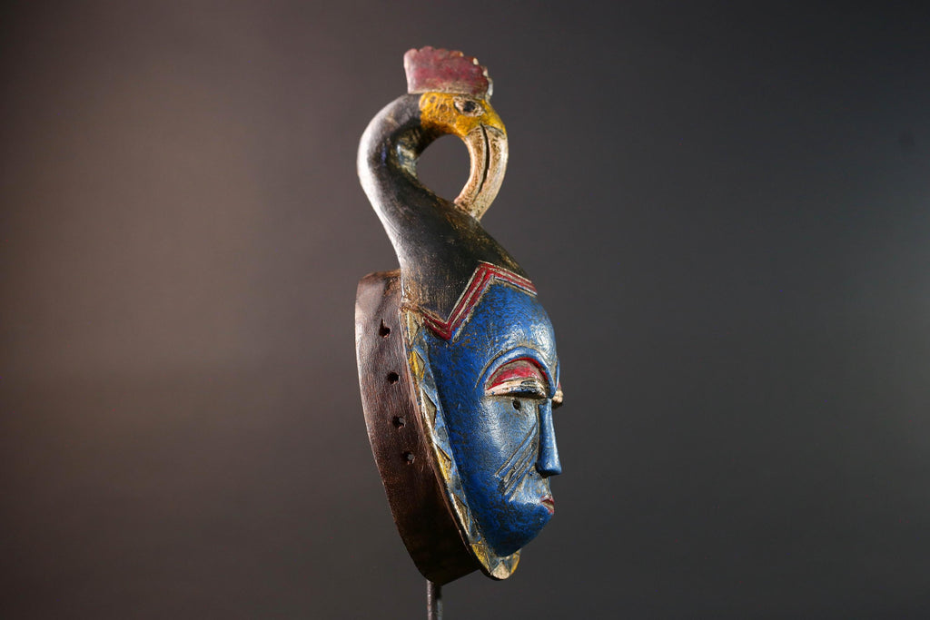 African tribal mask Guro carved wood wall decor with blue face bird crest scarification red white eyelids artisan symbolic sculpture-G5517