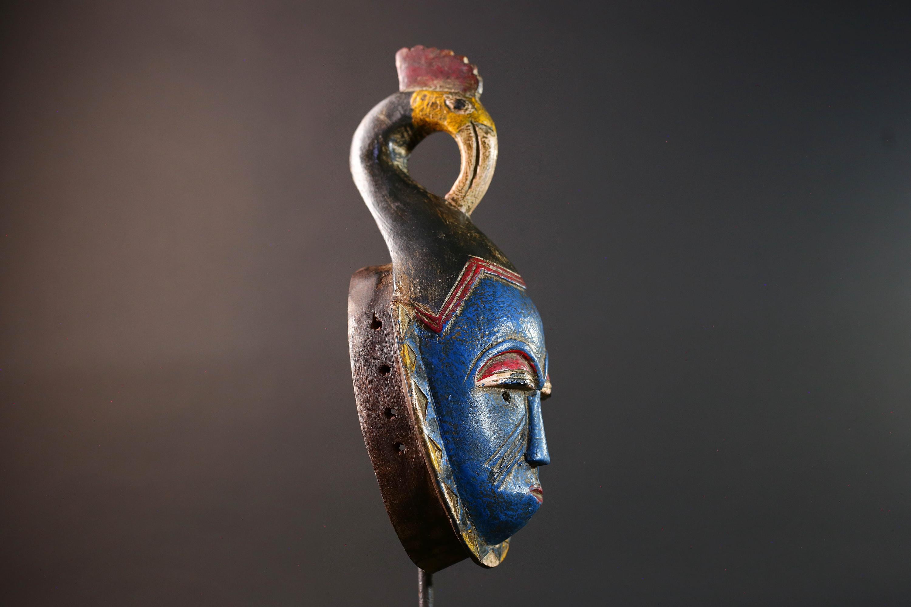 African tribal mask Guro carved wood wall decor with blue face bird crest scarification red white eyelids artisan symbolic sculpture-G5517