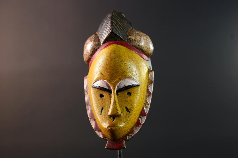 African mask Baule tribe yellow face carved wood with almond eyes rounded side buns geometric cheeks and central crest wall decor-G5539