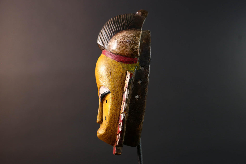 African mask Baule tribe yellow face carved wood with almond eyes rounded side buns geometric cheeks and central crest wall decor-G5539