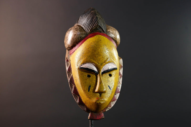African mask Baule tribe yellow face carved wood with almond eyes rounded side buns geometric cheeks and central crest wall decor-G5539