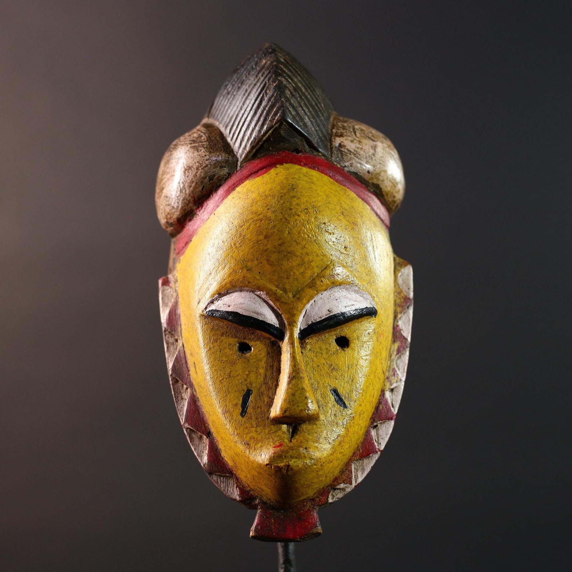 African mask Baule tribe yellow face carved wood with almond eyes rounded side buns geometric cheeks and central crest wall decor-G5539