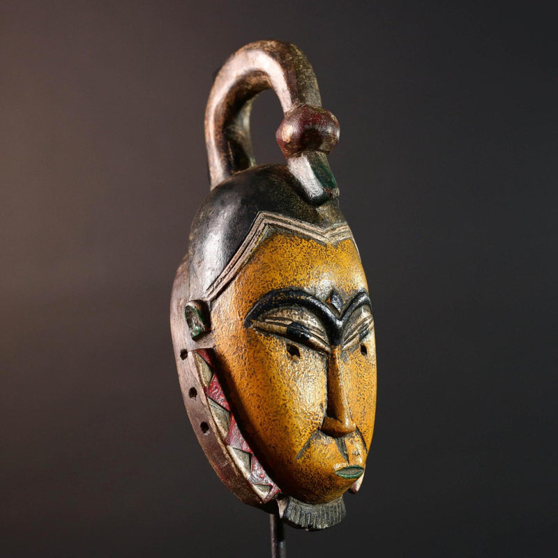 African mask Guro carving yellow face with animal crest red white triangle trim tribal wall decor wood sculpture spiritual art-G5548