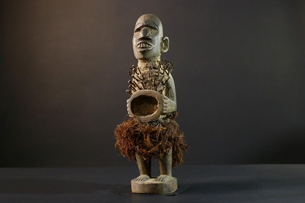 African Nkisi Nkondi nailed fetish statue Congo power figure tribal charm carved wood ritual art protective totem cavity raffia skirt-G5371