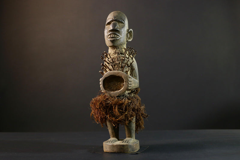 African Nkisi Nkondi nailed fetish statue Congo power figure tribal charm carved wood ritual art protective totem cavity raffia skirt-G5371