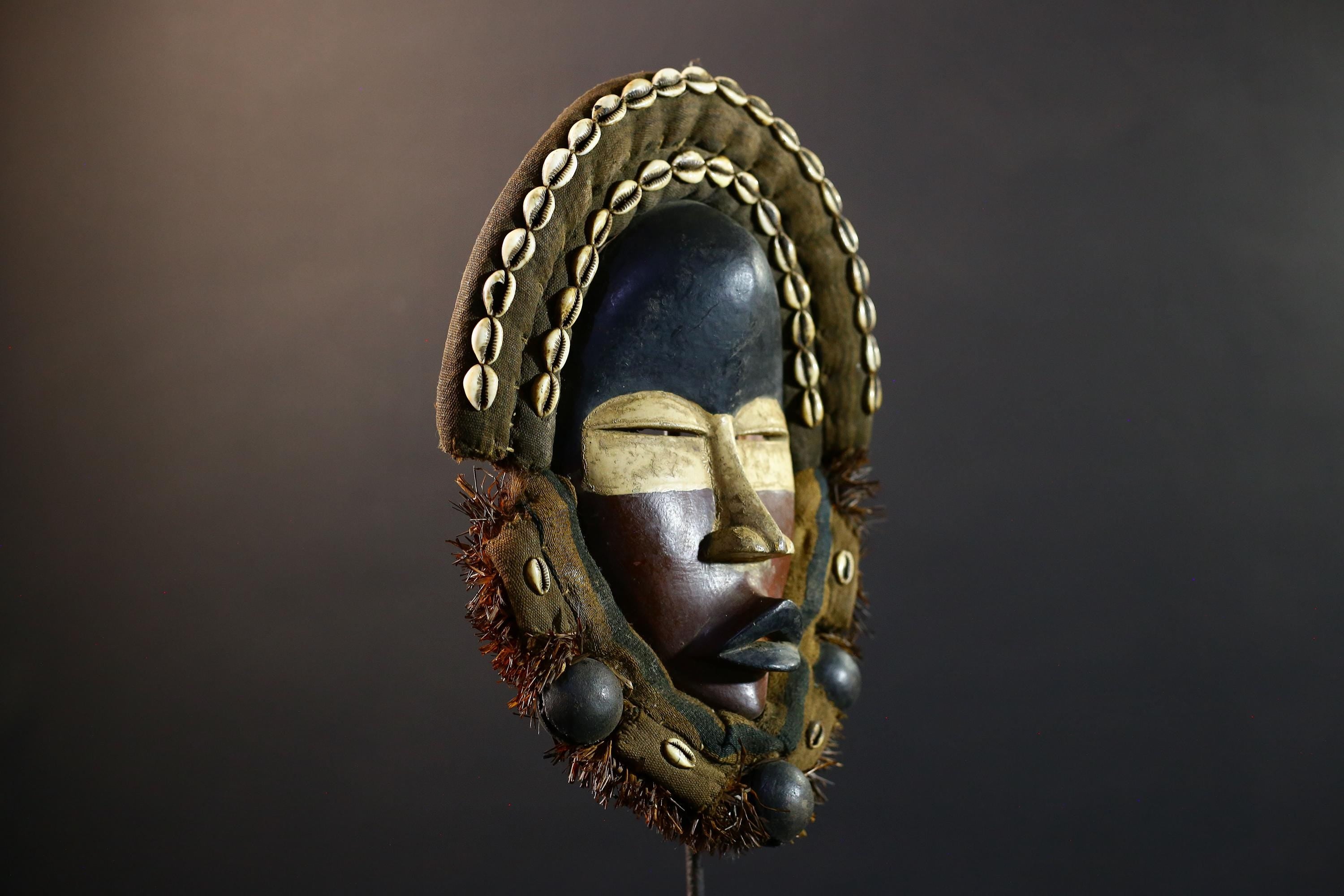 African Dan mask cowrie shell tribal wood wall decor spiritual carving fabric trim ritual mask handmade Côte d’Ivoire ethnic sculpture-G5360