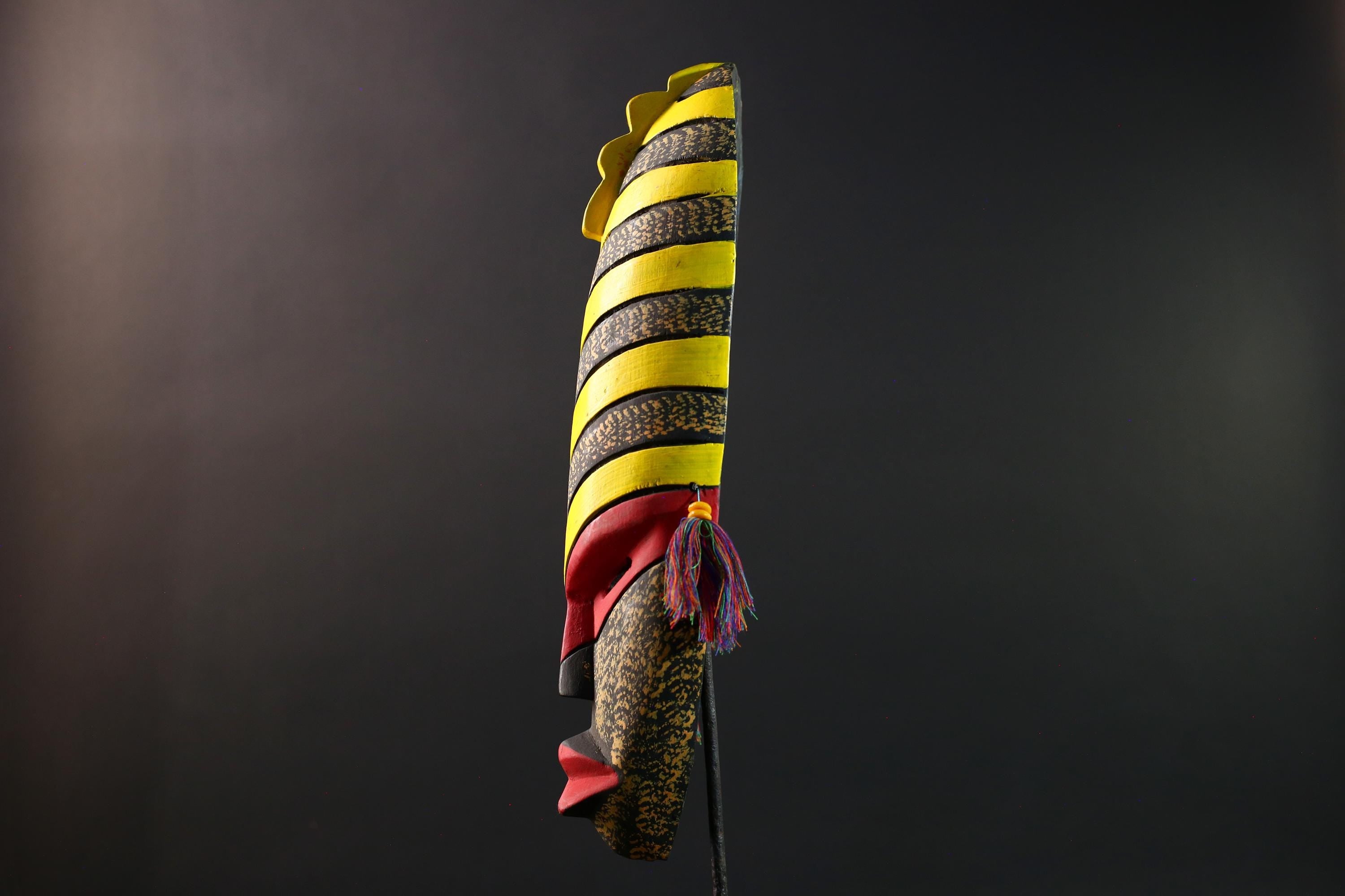 African tribal mask yellow black chevron face carving with red eyes and side tassels from Gabon or Congo handmade wall decor art- G5441