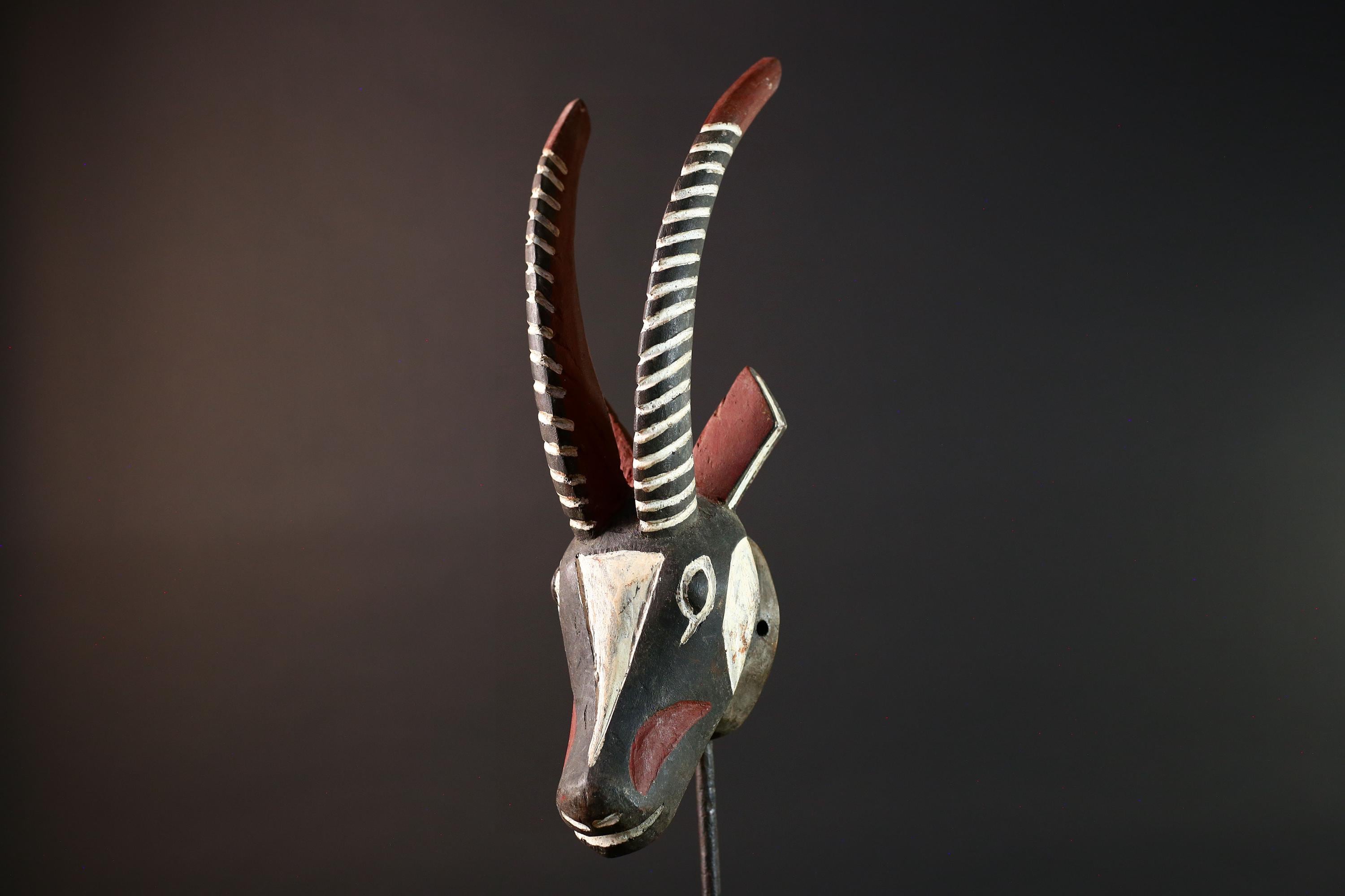 African antelope mask tribal animal head with striped horn and red black white painted wood Bobo Bamana style wall decor sculpture G5568