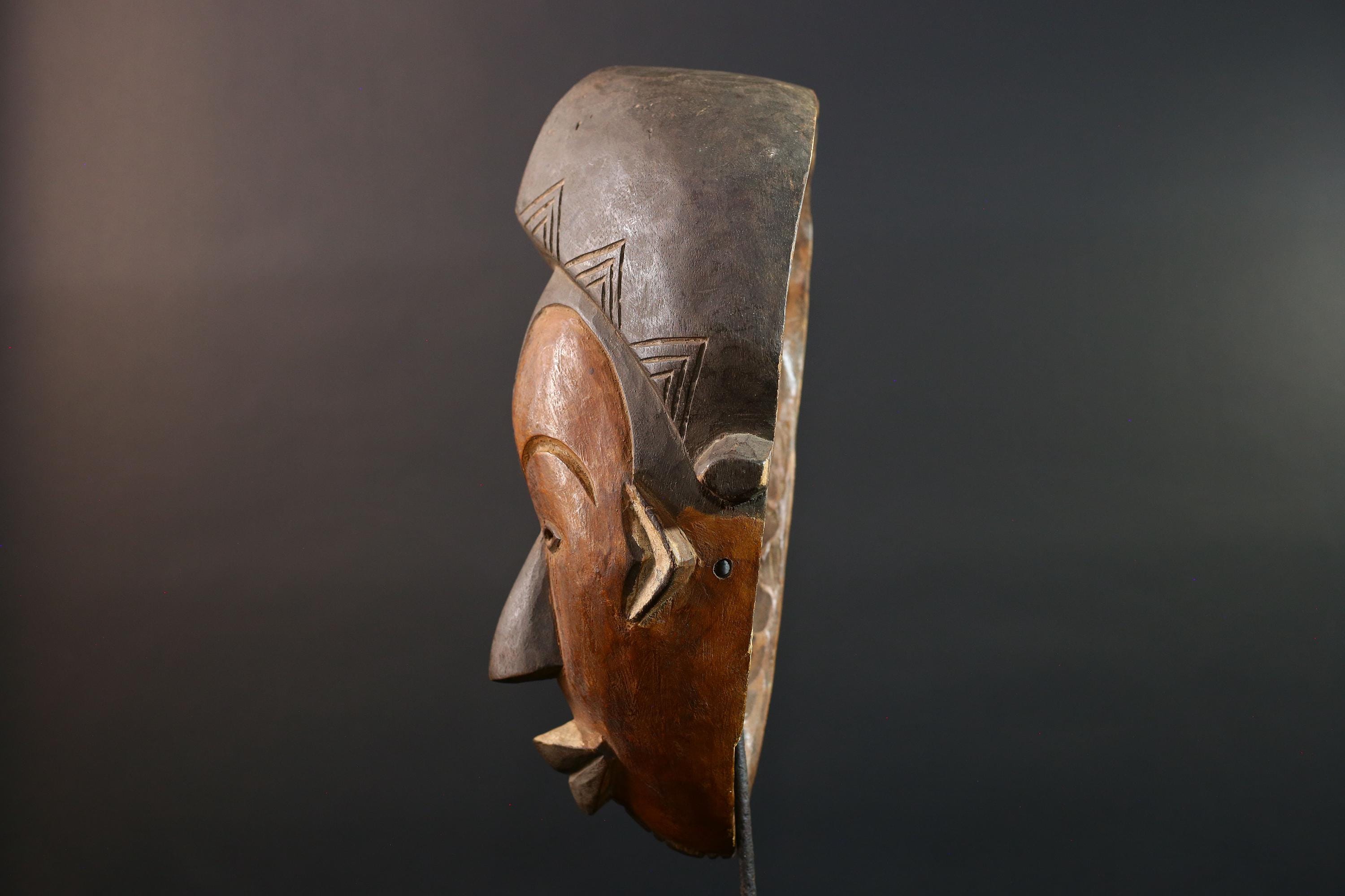 Hand carved African Punu mask tribal wall decor with kaolin white face and tall braided crest art from Central Africa G5569