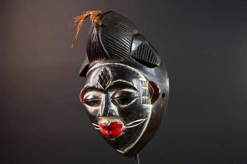 Punu tribal carving with red lips, black wood mask with fiber crest, ancestral spirit face art, African wall decor sculpture G5570