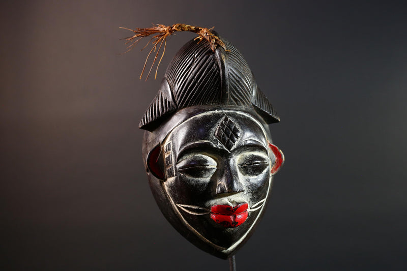 Punu tribal carving with red lips, black wood mask with fiber crest, ancestral spirit face art, African wall decor sculpture G5570