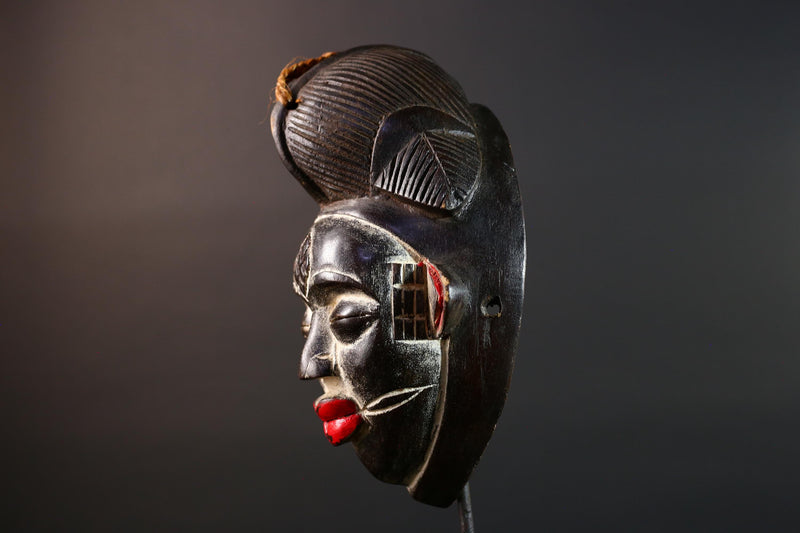 Punu tribal carving with red lips, black wood mask with fiber crest, ancestral spirit face art, African wall decor sculpture G5570
