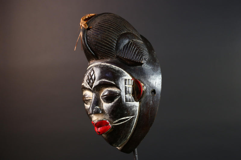 Punu tribal carving with red lips, black wood mask with fiber crest, ancestral spirit face art, African wall decor sculpture G5570