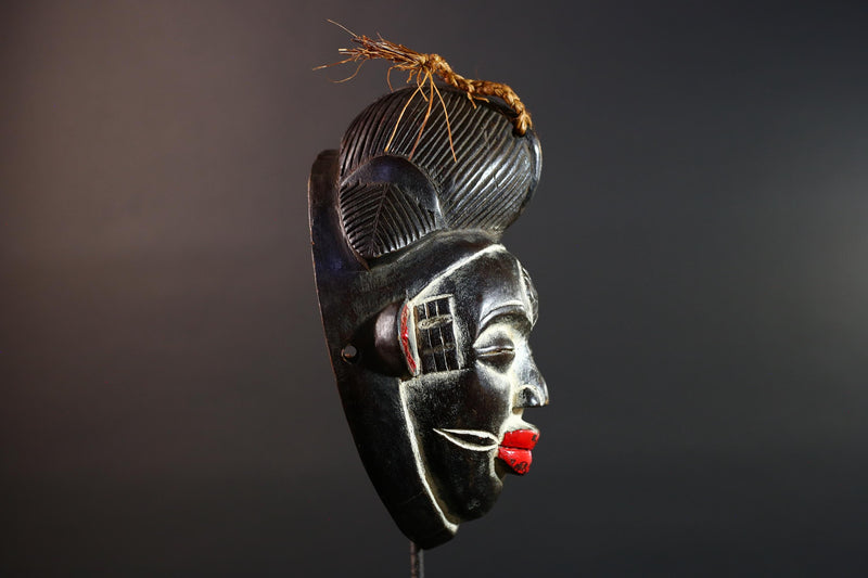Punu tribal carving with red lips, black wood mask with fiber crest, ancestral spirit face art, African wall decor sculpture G5570