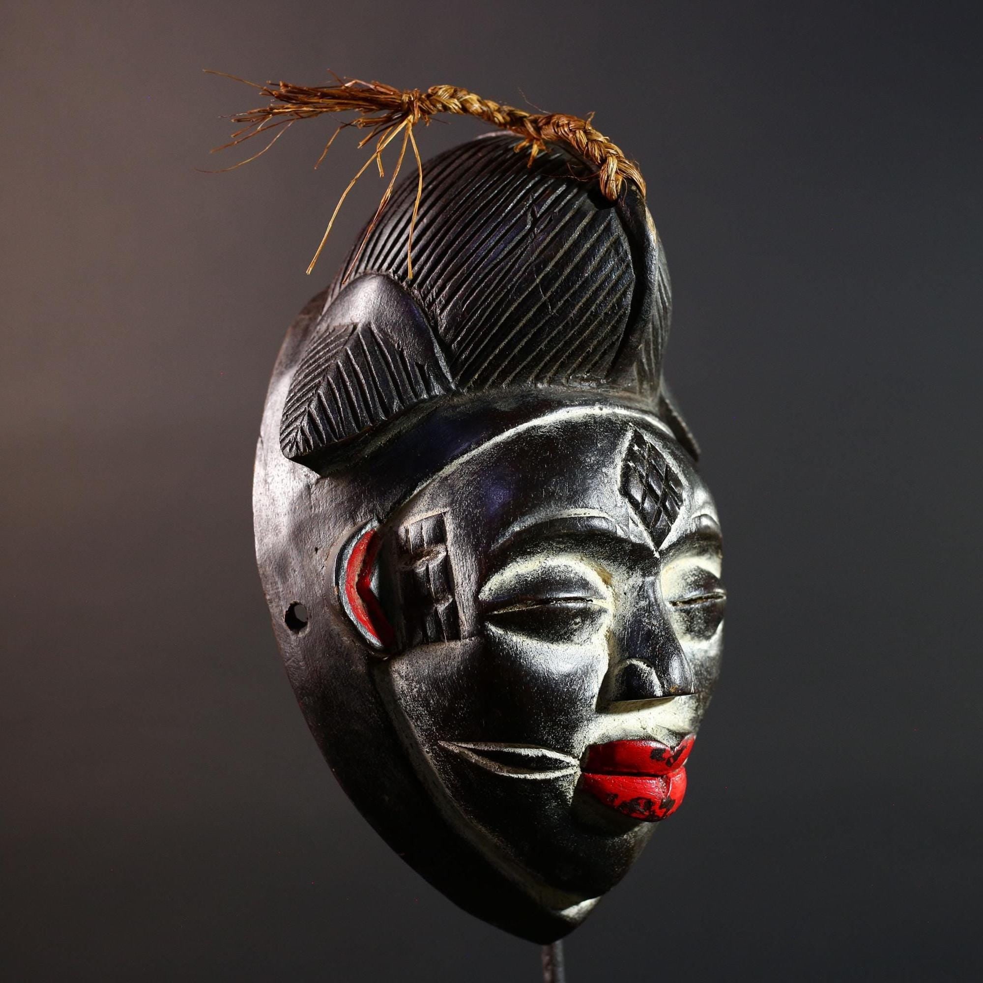Punu tribal carving with red lips, black wood mask with fiber crest, ancestral spirit face art, African wall decor sculpture G5570