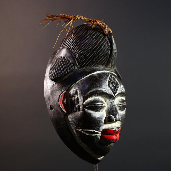 Punu tribal carving with red lips, black wood mask with fiber crest, ancestral spirit face art, African wall decor sculpture G5570