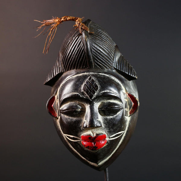 Punu tribal carving with red lips, black wood mask with fiber crest, ancestral spirit face art, African wall decor sculpture G5570