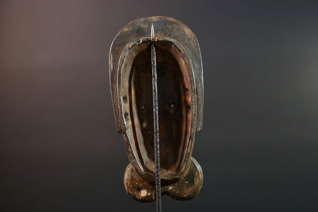 African mask Songye tribal decor with carved geometric features, red angular face, and bold cheek shapes wall hanging sculpture G5572