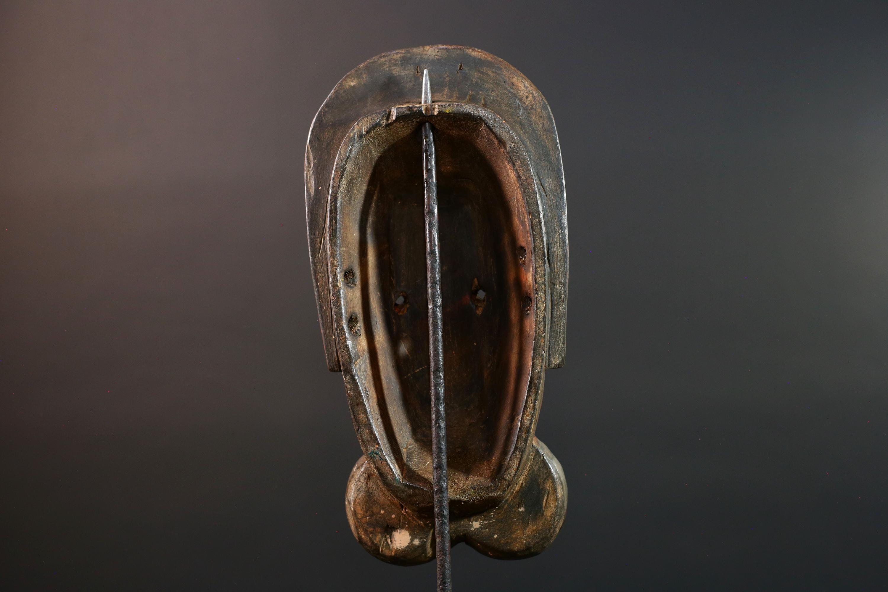 African mask Songye tribal decor with carved geometric features, red angular face, and bold cheek shapes wall hanging sculpture G5572