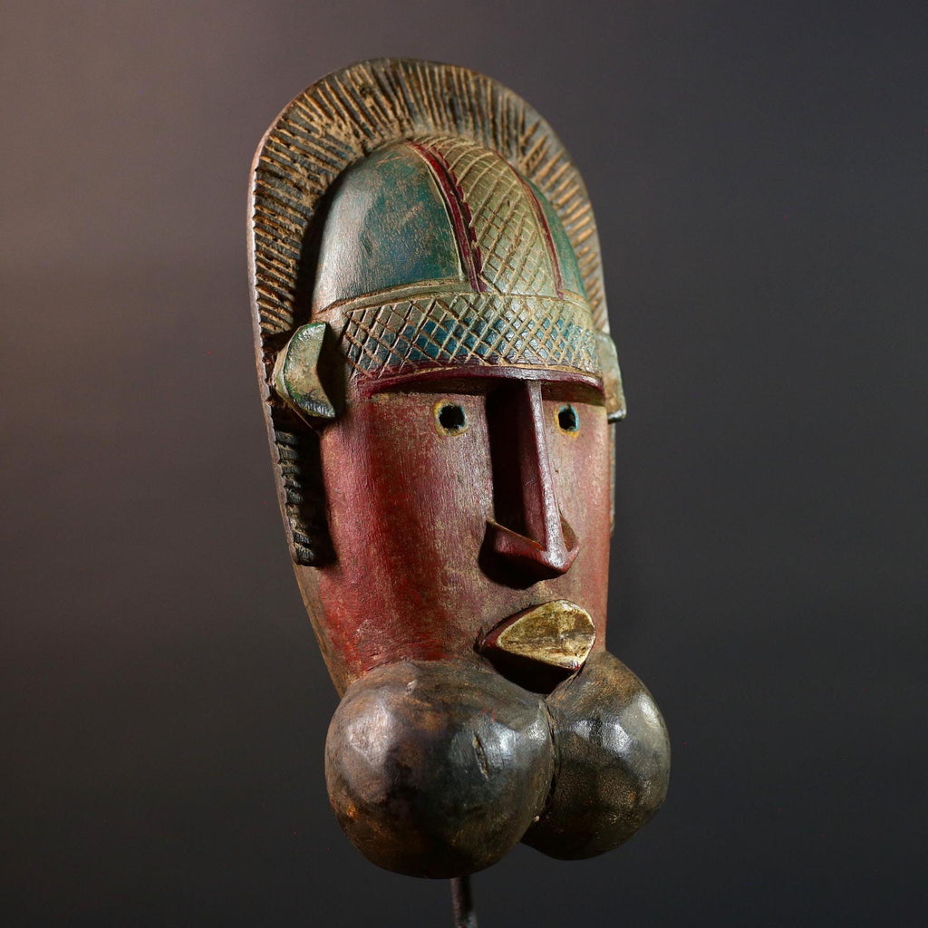 African mask Songye tribal decor with carved geometric features, red angular face, and bold cheek shapes wall hanging sculpture G5572