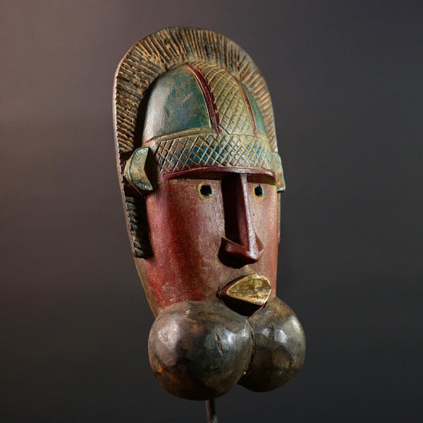 African mask Songye tribal decor with carved geometric features, red angular face, and bold cheek shapes wall hanging sculpture G5572