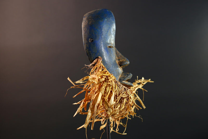 African mask Dan blue face with raffia fringe, slitted eyes, tribal carving from Côte d’Ivoire for ceremonial wall art or decor G5576