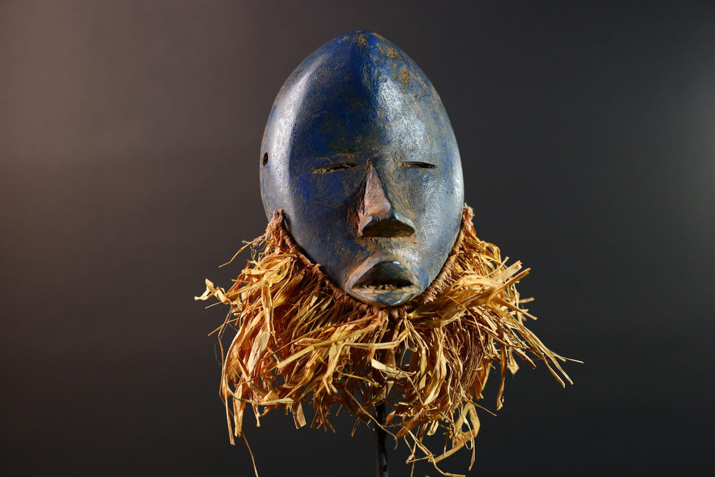 African mask Dan blue face with raffia fringe, slitted eyes, tribal carving from Côte d’Ivoire for ceremonial wall art or decor G5576