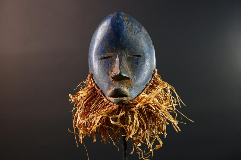 African mask Dan blue face with raffia fringe, slitted eyes, tribal carving from Côte d’Ivoire for ceremonial wall art or decor G5576
