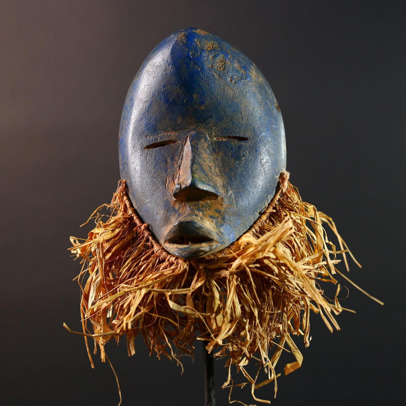 African mask Dan blue face with raffia fringe, slitted eyes, tribal carving from Côte d’Ivoire for ceremonial wall art or decor G5576