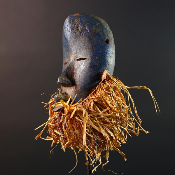 African mask Dan blue face with raffia fringe, slitted eyes, tribal carving from Côte d’Ivoire for ceremonial wall art or decor G5576