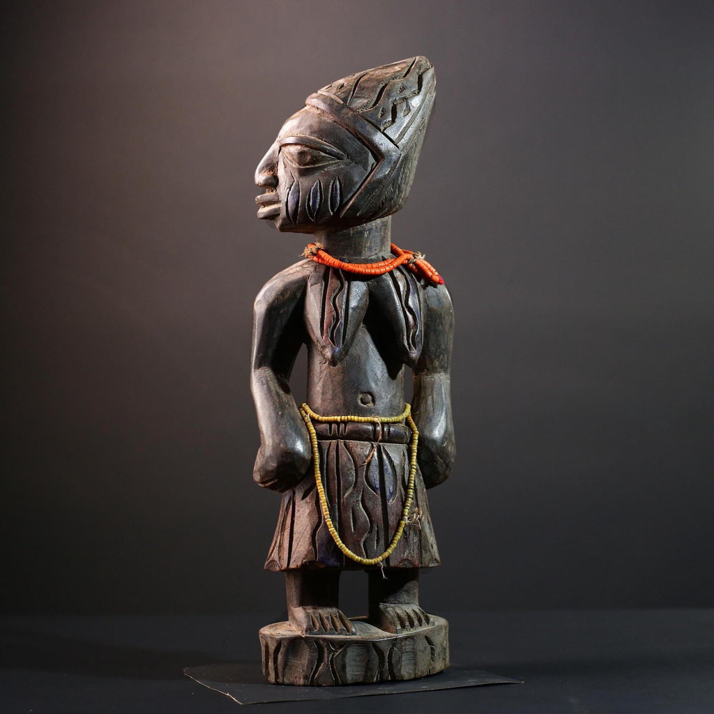 African statue Yoruba carved female figure from Nigeria with beads, tribal details, and dark finish for spiritual home decor G5561