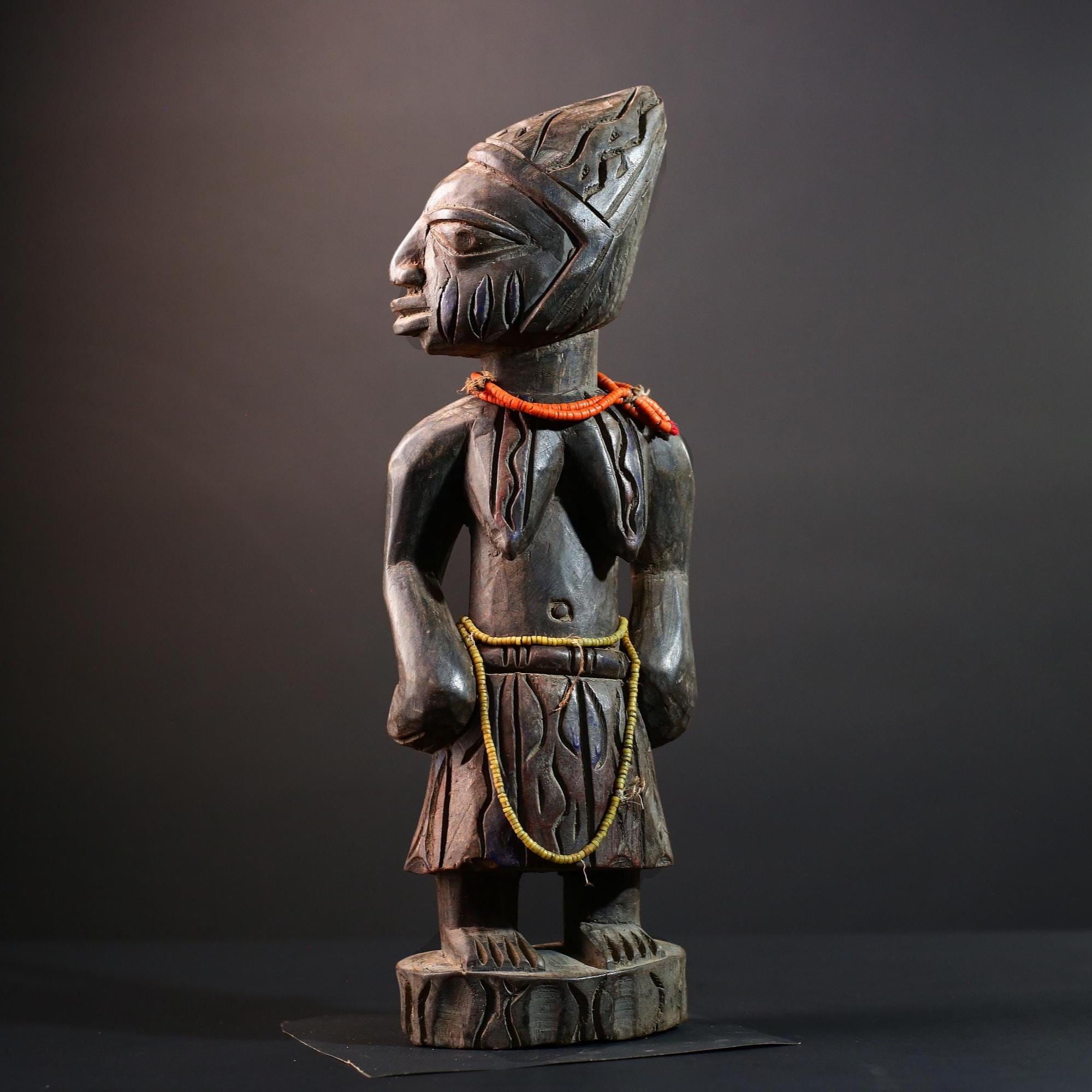 African statue Yoruba carved female figure from Nigeria with beads, tribal details, and dark finish for spiritual home decor G5561